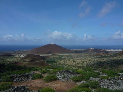 Ascension_Island-Landscape-SY_Yindee_Plus brown sandy hills with a green fertile plateau surrounding them and the sea behind
