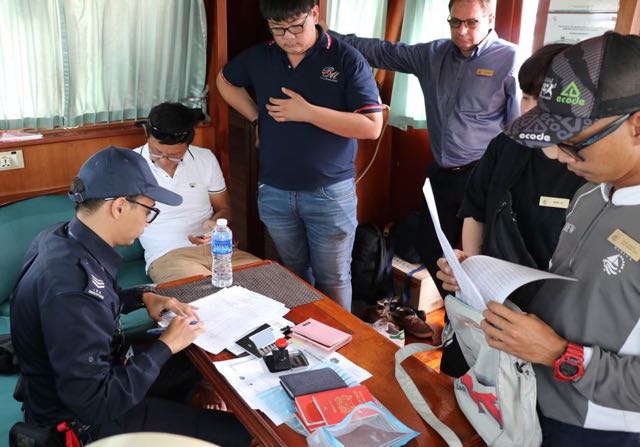 Singapore CIQ officials undertaking clearance